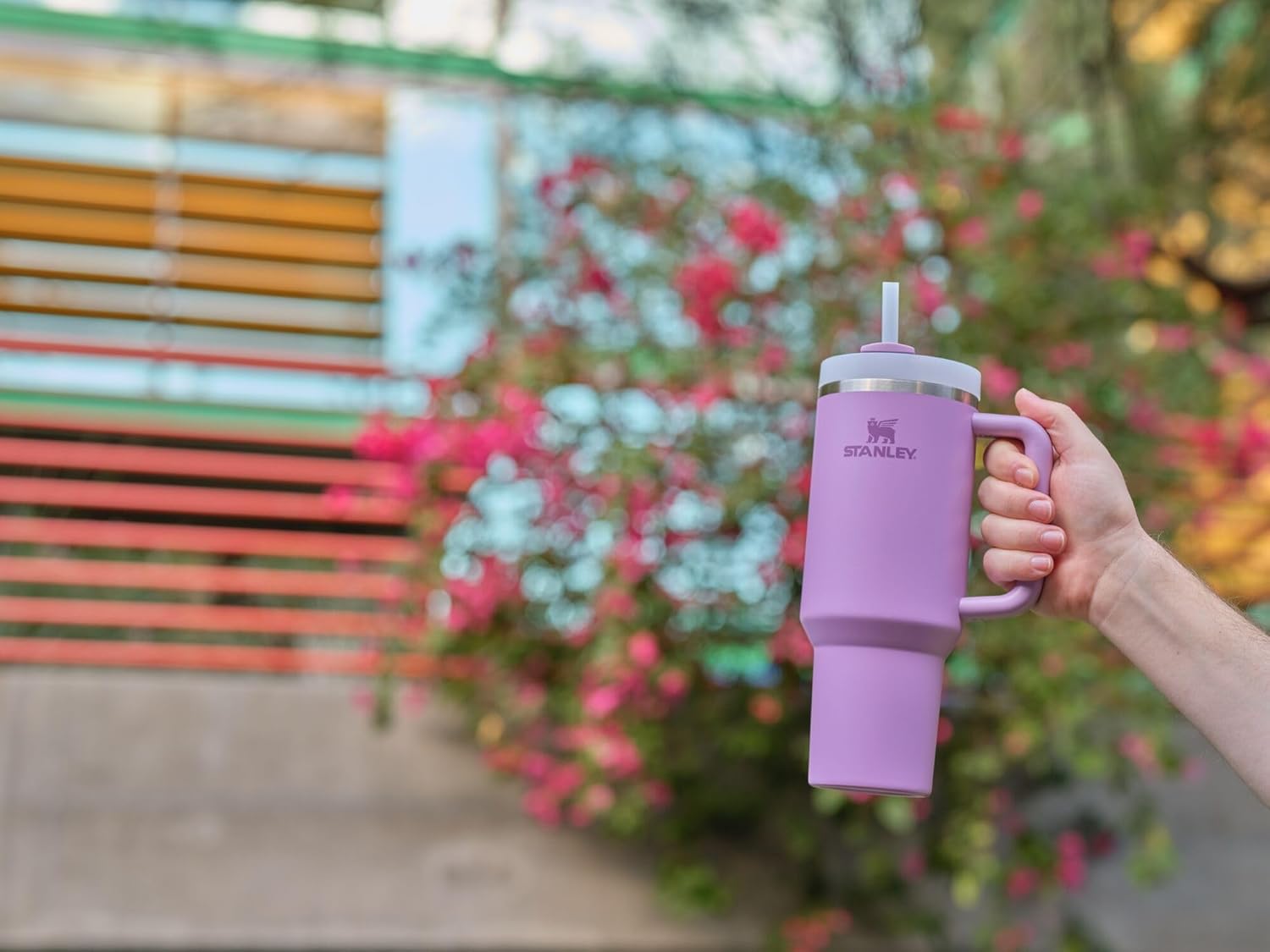 Constructed of recycled stainless steel for sustainable sipping, our 40 oz Quencher H2.0 offers maximum hydration with fewer refills. Commuting, studio workouts, day trips or your front porch—you’ll want this tumbler by your side. Thanks to Stanley’s vacuum insulation, your water will stay ice-cold, hour after hour. The advanced FlowState™ lid features a rotating cover with three positions: a straw opening designed to resist splashes while holding the reusable straw in place, a drink opening, and a full-cover top. The ergonomic handle includes comfort-grip inserts for easy carrying, and the narrow base fits just about any car cup holder. - Image 4